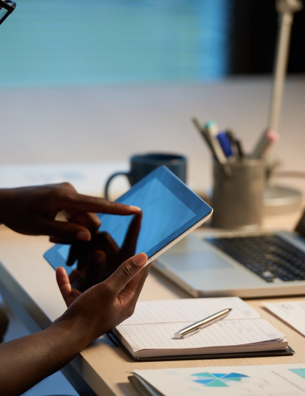 Cropped image of business woman using app on her tablet